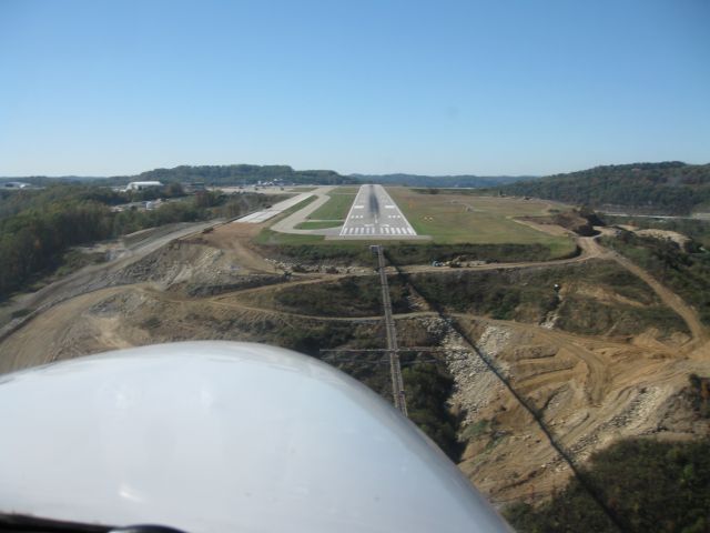 Cessna 310 (C-GKAS) - Short final...23