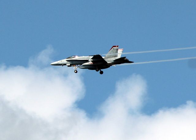 McDonnell Douglas FA-18 Hornet — - Photo taking March 11, 2017 from the deck of a whale watching boat just off Waikiki Beach. Aircraft probably on approach to Hickam.