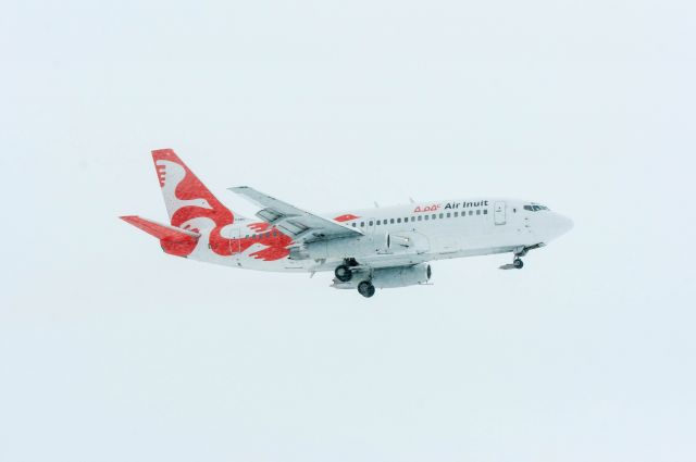 Boeing 737-700 (C-GMAI) - landing runway 08 on this snowy day.