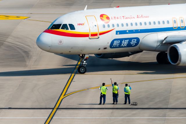 Airbus A320 (B-6837) - Tian Jing Airlines "xiyuan" livery is ready to departure with ground service waveing hands