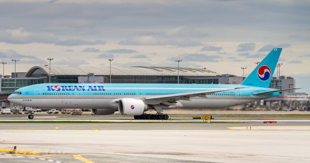 BOEING 777-300ER (HL8216) - KE074 begins her take off roll on runway 33R departing to Incheon