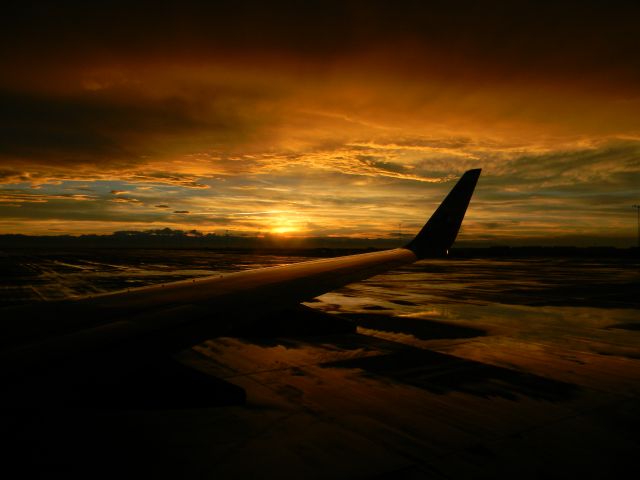 Boeing 737-700 — - Beautiful sunset over Denver International Airport. Unedited photo taken July 2011.