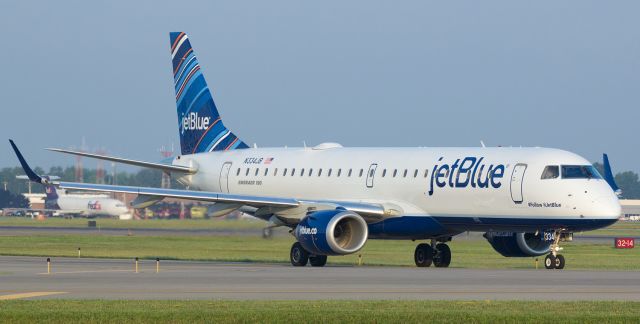 Embraer ERJ-190 (N334JB) - Without a doubt, the absolute best spotting location at Buffalo Niagara International, especially at sunrise on a summer morning.  JBUs N334JB is captured here as it rolls along taxiway Alpha toward runway 23 where it will depart for New York (KJFK). 