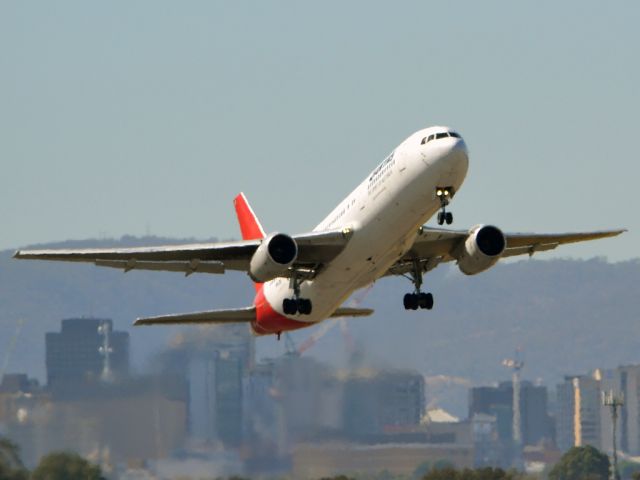 BOEING 767-300 (VH-ZXF) - Getting airborne off runway 23 on this beautiful Adelaide autumn day. Thursday 12th April 2012.