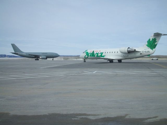 Canadair Regional Jet CRJ-200 (C-GJZL) - Luftwaffe Airbus 310 arring and Air Canada JAZZ departing Goose Airport NL. March 27/09