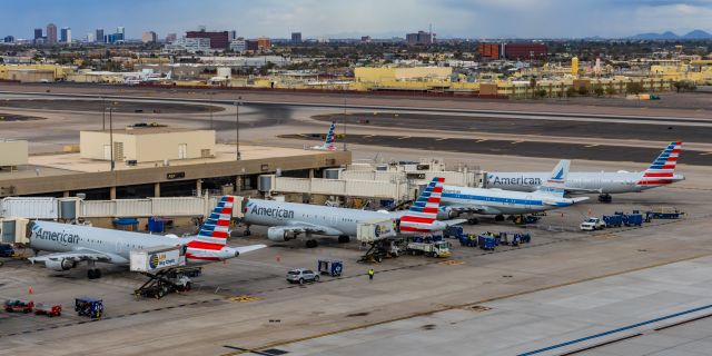 Airbus A319 (N744P) - An American Airlines A319 in Piedmont retro livery parked at PHX on 2/13/23, the busiest day in PHX history, during the Super Bowl rush. Taken with a Canon R7 and Canon EF 100-400 II L lens.