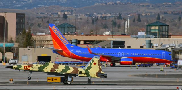 Northrop RF-5 Tigereye (76-1536) - For a third straight morning, "Bogey One Oh," a VFC-13 "Fighting Saints" Northrop F-5N Tiger II, performs a single here-and-gone pass at Reno Tahoe International; on this day along runway 16R-34L.  VFC-13 is the aggressor squadron at TopGun at NAS Fallon just "down the road" a bit east of Reno. 