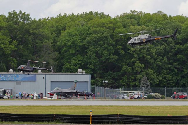 Eurocopter AS-350 AStar (N73HP) - In hot pursuit! Ok, maybe not. Here is an Ohio State Highway Patrol Eurocopter A350 departing the ramp as an Intrepid Helicopters R44 lands after another flight around the airport.