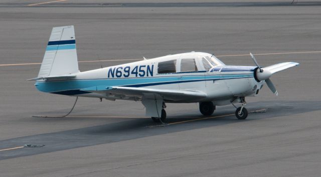 Mooney M-20 (N6945N) - This morning while walking my dog I was able to snap this picture of the aircraft parked at El Aero.