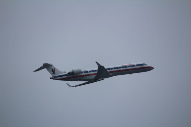 Canadair Regional Jet CRJ-700 (N530EA) - Taking off from 4R at KORD.  EGF3757 flying to KSLC.  Photo taken from Scott St.