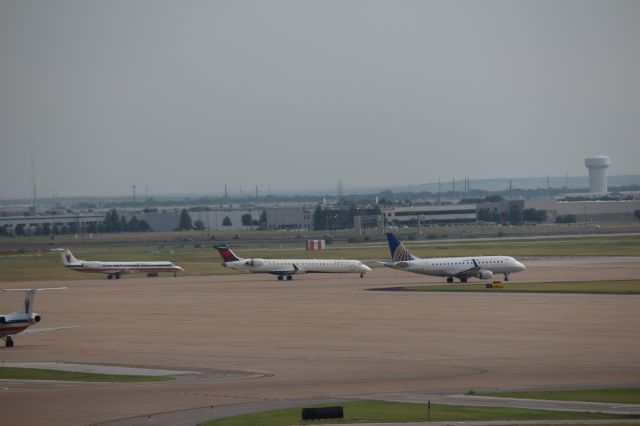 Embraer 170/175 (N634RW) - 081513 at the NE Hold Pad for Rwy 17R. United E170-series, Delta CRJ700, and AE E145