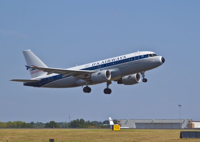 Airbus A319 (N745VJ) - A Saturday afternoon departure for New Yorks La Guardia Airport from US Airways Hub at Charlotte, North Carolina. This "legacy" paint scheme commemorates the employees of Allegheny Airlines, which evolved into US Airways in the late 1970s. Select "full" to read the word "Vistajet" under the co-pilots window.