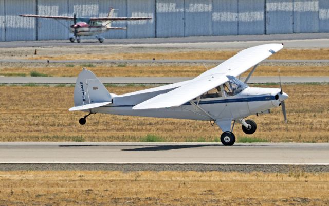 Piper PA-12 Super Cruiser (N3318M) - Piper PA-12 Super Cruiser making a one wheel touch and go at Livermore Municipal Airport  CA.