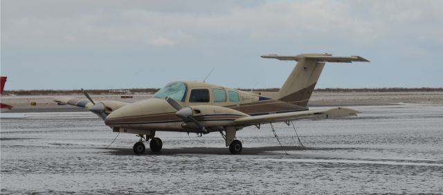 Beechcraft Duchess (N1850N) - N1850N seen in light snow at KBKL. Please look for more photos at Opshots.net