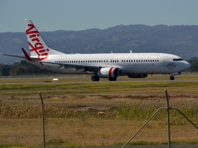 Boeing 737-800 (VH-YFK) - On taxi-way heading for take off on runway 05. Thursday 12th April 2012.