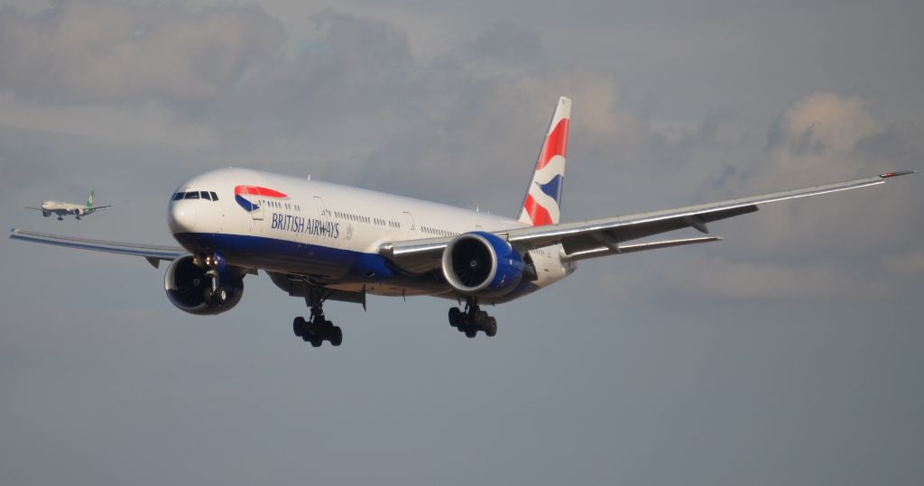 BOEING 777-300 (G-STBJ) - G-STBJ seen on final to LAXs 25L and the other aircraft, just above the right wing,  is another "trip 7" on final to 24R on the North side of the field.