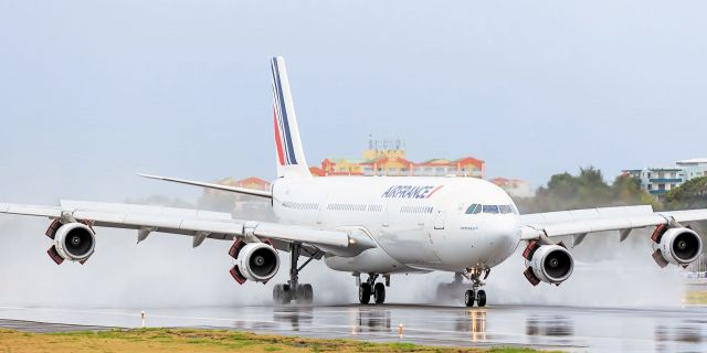 Airbus A340-300 (F-GLZO) - Air france landing on a wet runaway at TNCM St Maarten.