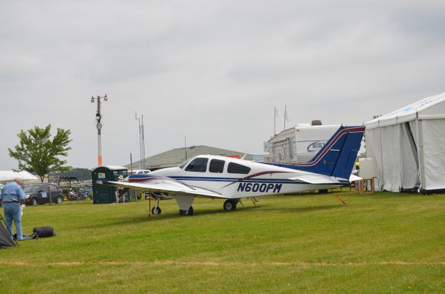 Beechcraft 55 Baron (N600PM) - Parked in the North 40 at Airventure 2014.