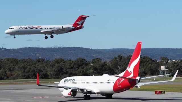 Fokker 100 (VH-NHF) -  Fokker 100 sn 11458. Qantaslink name Lindsay Evans VH-NHF rwy 03 YPPH, VH-XZM waiting for a clearance 02 July 2022