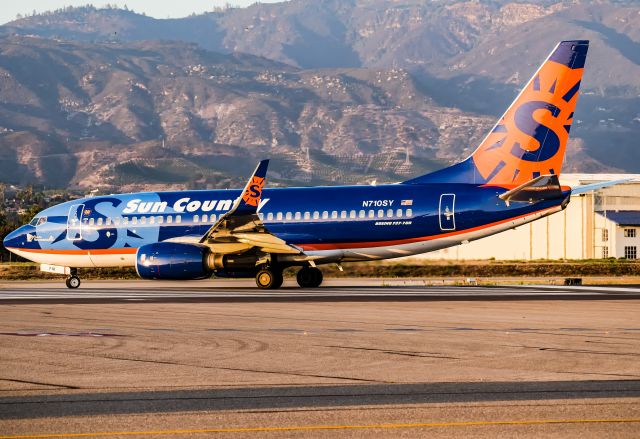 Boeing 737-700 (N710SY) - Lining up on 25 for a golden hour departure to Minneapolis