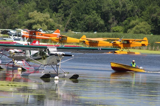 Piper NE Cub — - Seaplane Base at Oshkosh with J-3s in background.