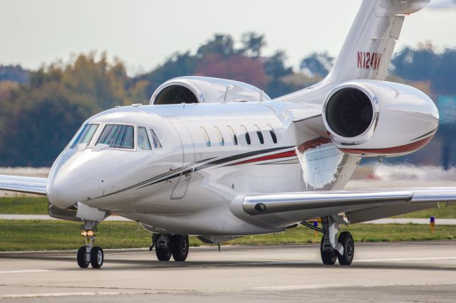 Cessna Citation X (N124MV) - N124MV is a 2016 Cessna Citation X (750) seen here taxiing to the ramp shortly after landing at Atlanta's PDK executive airport. I shot this with a Canon 500mm lens. Camera settings were 1/6400 shutter, F4, ISO 320.  Please check out my other photography. Votes and positive comments are always appreciated. Questions about this photo can be sent to Info@FlewShots.com