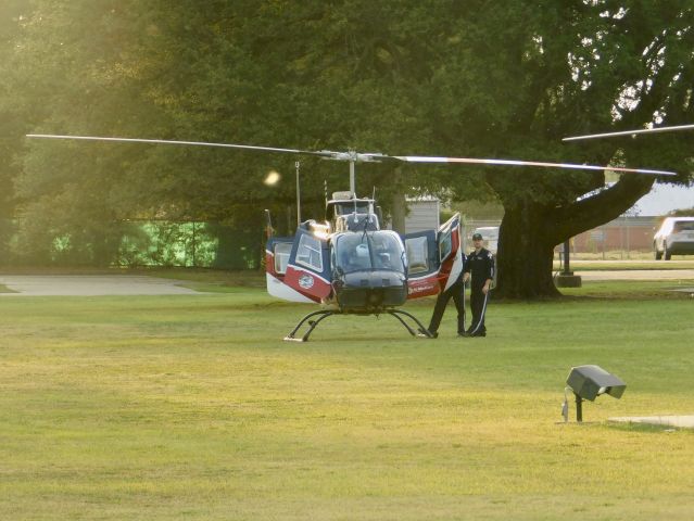 Bell JetRanger (N539AE) - Air Evac 87 at Bolivar Medical Center in the grass waiting for Pafford Air One Echo to depart