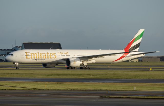 Boeing 777-200 (A6-ENF) - Left of Runway 22R