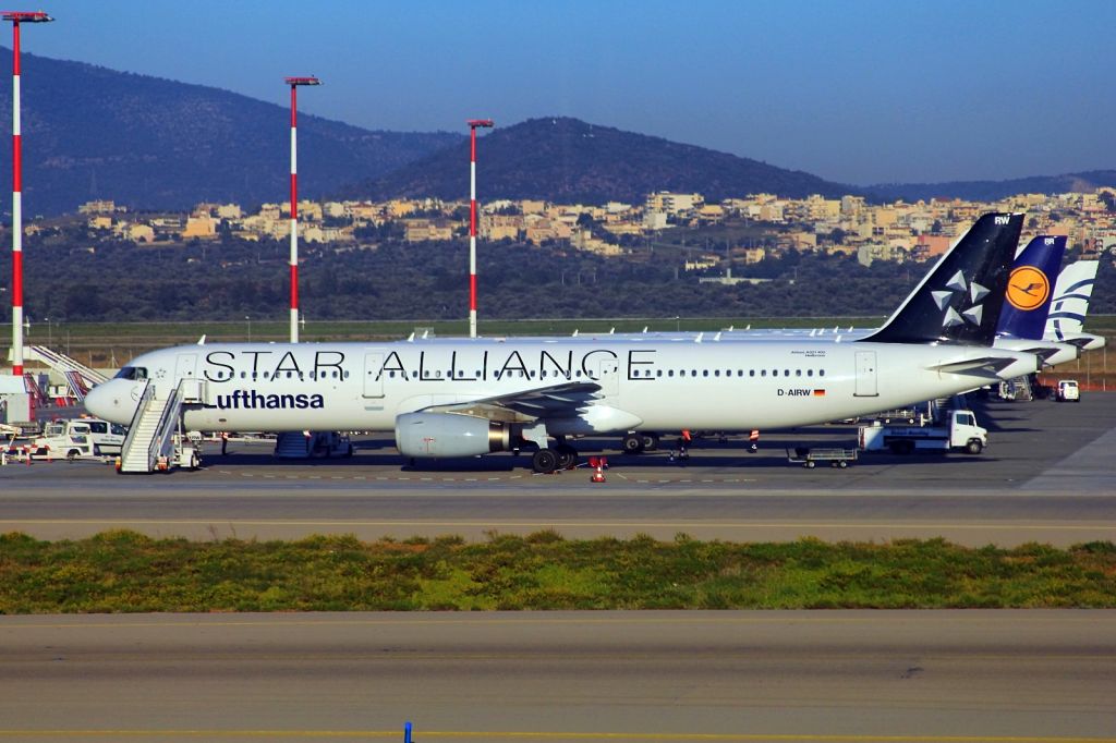 Airbus A321 (D-AIRW) - Lufthansa Airbus 321-131 reg. D-AIRW and another Lufthansa with the Star-Alliance livery, and Agean planes on tarmac at Athens airport. picture date: 11/2015.