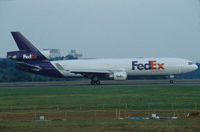 Boeing MD-11 (N604FE) - Departure at Narita Intl Airport Rwy16R on 1996/10/19