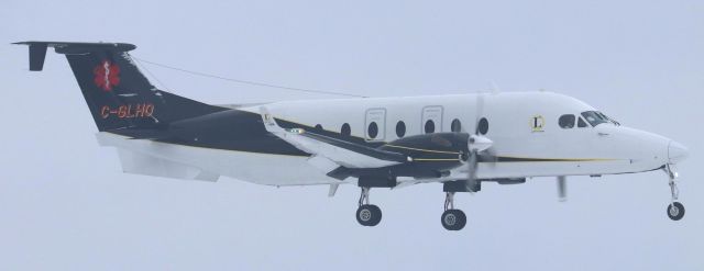 Beechcraft 1900 (C-GHLO) - Latitude Air Ambulance Beechcraft 1900D (C-GHLO) on short final for Runway 32 at YOW concluding a medevac flight from YSB on 10 Dec 23