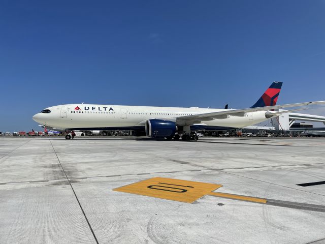 Airbus A330-900 (N405DX) - At cargo seven after fueling a CRJ, this A330 gets clearance to taxi out for takeoff.