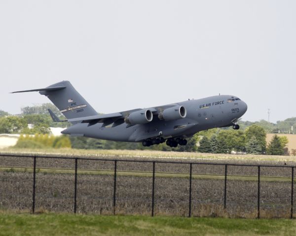 — — - C-17 Globemaster on climb-out from KDPA enroute to Washington D.C.