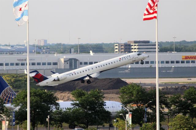 Canadair Regional Jet CRJ-900 (N303PQ) - Delta Connection/ Endeavor Air (DL/9E) N303PQ CRJ-900 [cn15303]br /Chicago O’Hare (ORD). Delta Connection/ Endeavor Air flight DL3404/9E3404 departs Runway 14L to New York Kennedy (JFK).br /br /Taken from roof level (6th Floor) parking garage A.br /2018 06 07br /a rel=nofollow href=http://alphayankee.smugmug.com/Airlines-and-Airliners-Portfolio/Airlines/AmericasAirlines/Delta-Connection-DL-CPEVOOG79E/https://alphayankee.smugmug.com/Airlines-and-Airliners-Portfolio/Airlines/AmericasAirlines/Delta-Connection-DL-CPEVOOG79E//a