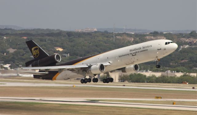 Boeing MD-11 (N291UP) - Departing 12R to DFW.