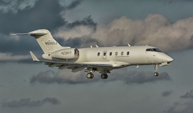 Bombardier Challenger 300 (N550XJ) - On final to 24R in CYHU. June 6, 2018