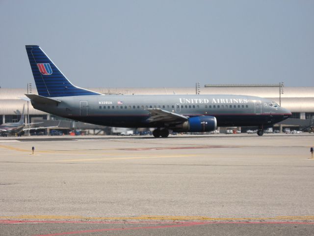 Boeing 737-700 (N328UA) - Holding on RWY 19R