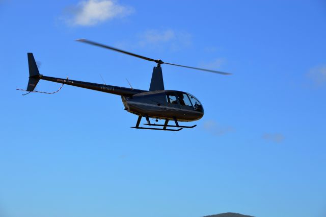 Robinson R-44 (VH-CTT) - Robinson R44 landing RWY 05 Flinders Island, Nov 2017