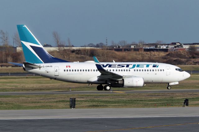 Boeing 737-700 (C-GWJG) - WJA1681 in the long wait for departures on 31L