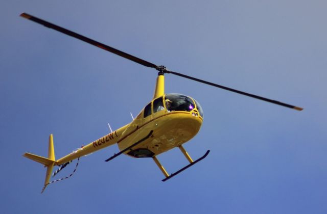 Robinson R-44 (N202WT) - N202WT, a Robinson R-44 Raven I (R44) is seen here on 07-MAR-2020 at approx 1212PST maneuvering low over residential Clairemont, a community of San Diego, CA. Telephoto taken while sitting on my balcony during one of my favorite pastimes: watching the planes go by.