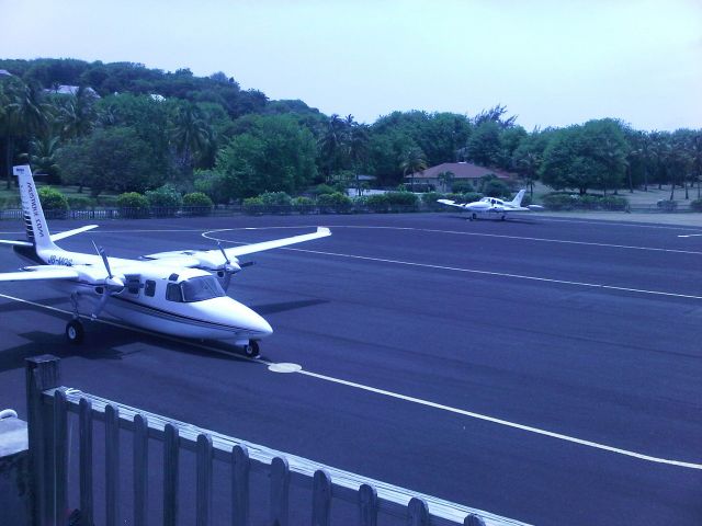 Aero U-9 Commander 680 Super (J8-MQS) - ramp view froam tower