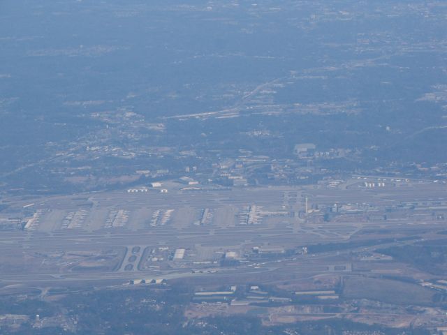 — — - A view of the Hartsfield-Jackson Atlanta International Airport from  above 10,000 ft.