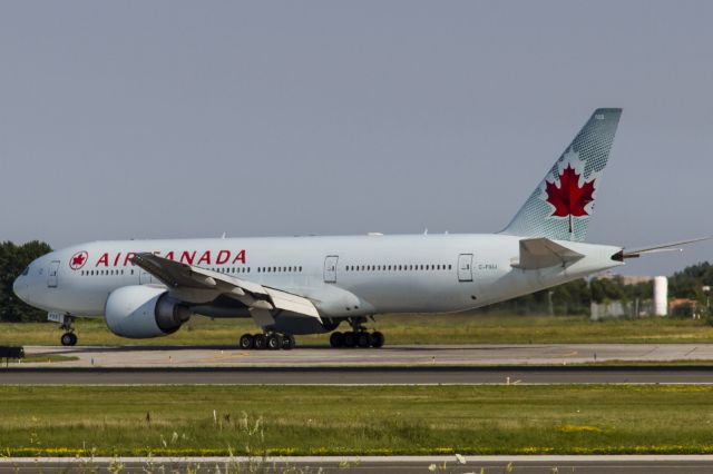 BOEING 777-200LR (C-FIUJ) - JUST LANDED ON RUNWAY 23, NOW TAXIING TO GATE