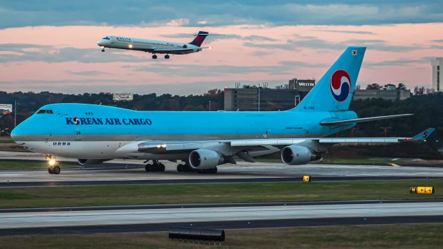 Boeing 747-400 (HL7400) - A KE 747 freighter lining up as a Delta MD-90 reaches the runway. Former now flying as N712CK with Kalitta Air. From my collection