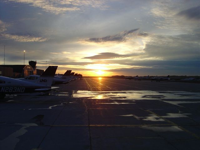 — — - Sunset on Bravo ramp at the University of North Dakota.