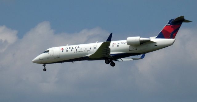 Canadair Regional Jet CRJ-200 (N980EV) - On final is this 2003 Delta Airlines Connection Canadair Regional Jet 200ER in the Summer of 2021.