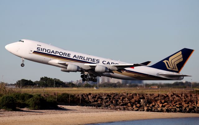 Boeing 747-400 (9V-SFK) - Climbing From Rwy 34L.Probably Light Weight.Getting Stuff to us and others when Needed!