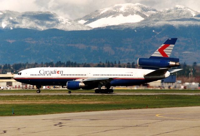 McDonnell Douglas DC-10 (C-FCRD) - CYVR - April 1999 view of Canadian DC-10 departing Vancouver BC - a fresh carpet of snow blankets the Coast Range of the Canadian Rockies east behind Vancouver.