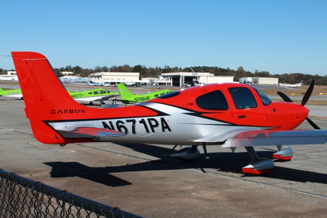 Cirrus SR22 Turbo (N671PA) - A rather new SR22 in front of the playground with an Apache in the background. Photo taken on 11/18/2020.