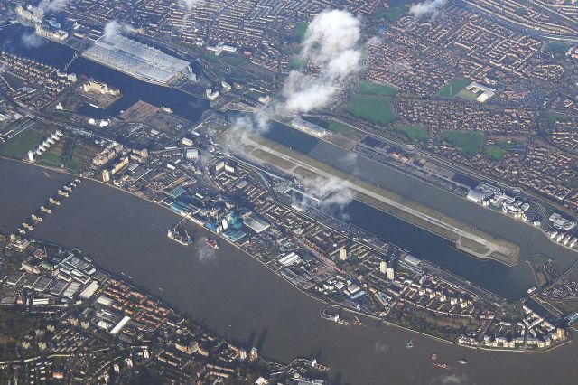 — — - Image of London City Aiport taken while flying out of Rotterdam Holland to Southampton UK - the route took us along the Thames River, London. Image Olympus OM-D 24-105 lens